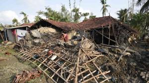 A woman salvages her belongings from her house damaged due to cyclone Amphan, at Kakdwip in the Sunderbans, South 24 Parganas district, West Bengal on May 22, 2020.(HT Archive) A woman salvages her belongings from her house damaged due to cyclone Amphan, at Kakdwip in the Sunderbans, South 24 Parganas district, West Bengal on May 22, 2020.(HT Archive)