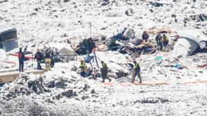 Rescue workers interrupt the search in the ruins after an alarm was triggered in the area, in Ask, Gjerdrum, Norway January 5, 2021.(via REUTERS) Rescue workers interrupt the search in the ruins after an alarm was triggered in the area, in Ask, Gjerdrum, Norway January 5, 2021.(via REUTERS)