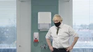 Britain's Prime Minister Boris Johnson during a visit to view the vaccination programme at the Chase Farm Hospital in north London, Monday.(AP)