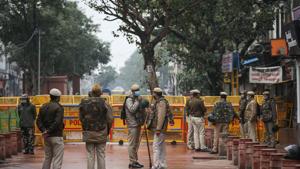 Delhi Police personnel stand guard during a protest by members of Vishwa Hindu Parishad (VHP) and Bajrang Dal over the demolition of a Hanuman temple, at Chandni Chowk, in New Delhi.(Sanchit Khanna/HT Photo) Delhi Police personnel stand guard during a protest by members of Vishwa Hindu Parishad (VHP) and Bajrang Dal over the demolition of a Hanuman temple, at Chandni Chowk, in New Delhi.(Sanchit Khanna/HT Photo)