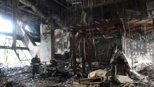A firefighter inspects damage during dousing operations after a fire broke out at a multistory DP Jindal Group corporate office in sector 44 near Huda City Center Metro Station, in Gurugram, India, on Tuesday, January 5, 2021. (Photo by Rahul Grover/Hindustan Times) A firefighter inspects damage during dousing operations after a fire broke out at a multistory DP Jindal Group corporate office in sector 44 near Huda City Center Metro Station, in Gurugram, India, on Tuesday, January 5, 2021. (Photo by Rahul Grover/Hindustan Times)