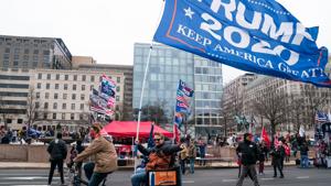 Supporters of U.S. President Donald Trump waves flags while protesting at Freedom Plaza in Washington, D.C., U.S., on Tuesday, Jan. 5, 2021. Washington's mayor, Muriel Bowser, urged residents not to engage with any protesters Supporters of U.S. President Donald Trump waves flags while protesting at Freedom Plaza in Washington, D.C., U.S., on Tuesday, Jan. 5, 2021. Washington's mayor, Muriel Bowser, urged residents not to engage with any protesters