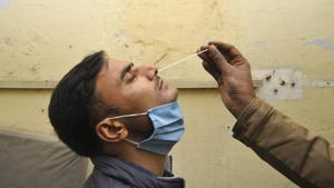 A health worker collects a swab sample from a man for coronavirus screening, at community health centre Bisrakh, in Greater Noida, India, on Tuesday, January 05, 2021. (Photo by Sunil Ghosh / Hindustan Times) A health worker collects a swab sample from a man for coronavirus screening, at community health centre Bisrakh, in Greater Noida, India, on Tuesday, January 05, 2021. (Photo by Sunil Ghosh / Hindustan Times)