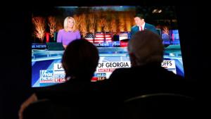 Guests watch news coverage of the run-off election for Georgia’s two Senate seats, featuring incumbent Republican U.S. Senators David Perdue and Kelly Loeffler and Democratic challengers Jon Ossoff and Raphael Warnock, at the GA GOP election night event in Atlanta, Georgia, U.S., January 5, 2021. REUTERS/Brian Snyder Guests watch news coverage of the run-off election for Georgia’s two Senate seats, featuring incumbent Republican U.S. Senators David Perdue and Kelly Loeffler and Democratic challengers Jon Ossoff and Raphael Warnock, at the GA GOP election night event in Atlanta, Georgia, U.S., January 5, 2021. REUTERS/Brian Snyder