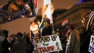 A supporter of US President Donald Trump holds a sign during a rally ahead of the US Congress certification of the November 2020 election results during protests in Washington, US on January 5, 2021.(Reuters File Photo) A supporter of US President Donald Trump holds a sign during a rally ahead of the US Congress certification of the November 2020 election results during protests in Washington, US on January 5, 2021.(Reuters File Photo)