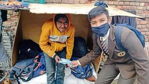 A student of Shishu Niketan Model Senior Secondary School, Sector 22-D, Chandigarh, giving mask to an underprivileged child. A student of Shishu Niketan Model Senior Secondary School, Sector 22-D, Chandigarh, giving mask to an underprivileged child.