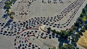 People line up for Covid tests in their vehicles at Dodger Stadium in Los Angeles, California.