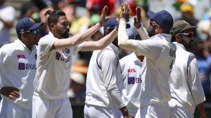 India's MD Siraj, second left, is congratulated by teammates(AP) India's MD Siraj, second left, is congratulated by teammates(AP)