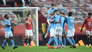 Soccer Football - Carabao Cup - Semi Final - Manchester United v Manchester City - Old Trafford, Manchester, Britain - January 6, 2021 Manchester City's Fernandinho celebrates scoring their second goal with teammates(Pool via REUTERS) Soccer Football - Carabao Cup - Semi Final - Manchester United v Manchester City - Old Trafford, Manchester, Britain - January 6, 2021 Manchester City's Fernandinho celebrates scoring their second goal with teammates(Pool via REUTERS)