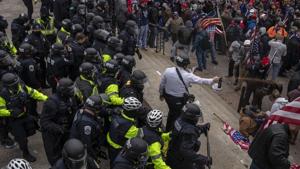 Pepper spray is used against demonstrators as they breach the US Capital building grounds in Washington.(Bloomberg) Pepper spray is used against demonstrators as they breach the US Capital building grounds in Washington.(Bloomberg)