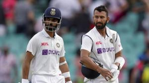 India's Ajinkya Rahane, left, and Cheteshwar Pujara walk from the field at the end of play on day two of the third cricket test between India and Australia at the Sydney Cricket Ground.(AP)