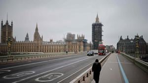 A pedestrian walks across a near-deserted Westminster Bridge in central London on January 8.(AFP) A pedestrian walks across a near-deserted Westminster Bridge in central London on January 8.(AFP)