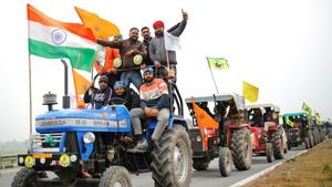 Farmers participate in a tractor rally to protest against the newly passed farm bills, on a highway on the outskirts of New Delhi.(REUTERS) Farmers participate in a tractor rally to protest against the newly passed farm bills, on a highway on the outskirts of New Delhi.(REUTERS)