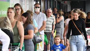 People line up to enter a grocery store before an impending lockdown due to an outbreak of the coronavirus disease (COVID-19) in Brisbane, Australia.(REUTERS) People line up to enter a grocery store before an impending lockdown due to an outbreak of the coronavirus disease (COVID-19) in Brisbane, Australia.(REUTERS)