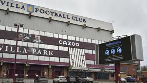 FILE - This Saturday, Nov. 21, 2020 file photo shows a general view of a social distancing message on display outside the Villa Park stadium, home of Aston Villa, in Birmingham, England. Aston Villa has on Thursday, Jan. 7, 2021 reported a “significant” coronavirus outbreak and closed its training ground a day before a scheduled FA Cup home game against Liverpool. Villa says “discussions are ongoing between medical representatives of the club, the Football Association and the Premier League.”(AP) FILE - This Saturday, Nov. 21, 2020 file photo shows a general view of a social distancing message on display outside the Villa Park stadium, home of Aston Villa, in Birmingham, England. Aston Villa has on Thursday, Jan. 7, 2021 reported a “significant” coronavirus outbreak and closed its training ground a day before a scheduled FA Cup home game against Liverpool. Villa says “discussions are ongoing between medical representatives of the club, the Football Association and the Premier League.”(AP)