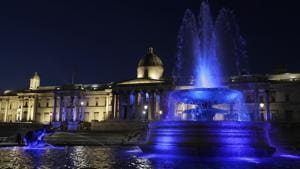Fountains in Trafalgar Square are lit with blue lights to show support for the NHS in London, on January 7, 2021.(AP) Fountains in Trafalgar Square are lit with blue lights to show support for the NHS in London, on January 7, 2021.(AP)