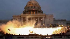 An explosion caused by a police munition is seen while supporters of US President Donald Trump gather in front of the Capitol Building in Washington.(REUTERS) An explosion caused by a police munition is seen while supporters of US President Donald Trump gather in front of the Capitol Building in Washington.(REUTERS)