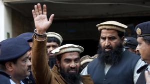 In this January 1, 2015, file photo, police officers escort Zakiur Rehman Lakhvi, center, the main suspect of the Mumbai terror attacks in 2008, after his court appearance in Islamabad, Pakistan.(AP file)