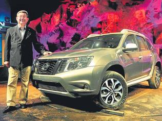 Nissan-India-president-Kenichiro-Yomura-poses-with-the-Terrano-SUV-in-Mumbai-on-Tuesday-Photo-AFP