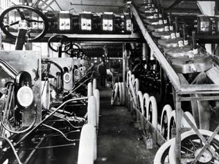 This-handout-picture-released-by-Ford-Motor-Company-shows-the-first-assembly-line-at-the-Highland-Park-Ford-Plant-in-Highland-Park-United-States-in-1913-It-began-on-October-7-1913-when-engineers-constructed-a-crude-system-using-a-rope-and-winch-to-pull-a-Ford-Model-T-past-140-workers-in-a-sprawling-new-factory-t-the-Crystal-Palace-in-Highland-Park-a-suburb-of-Detroit-Henry-Ford-launched-the-modern-assembly-line-a-century-ago-and-helped-spark-a-radical-transformation-of-both-manufacturing-and-society-By-drastically-reducing-the-cost-of-production-with-standardized-parts-and-more-efficient-assembly-Ford-was-able-to-bring-the-luxury-convenience-and-freedom-of-the-automobile-to-the-masses-Photo-AFP-Ford-Motor-Company This-handout-picture-released-by-Ford-Motor-Company-shows-the-first-assembly-line-at-the-Highland-Park-Ford-Plant-in-Highland-Park-United-States-in-1913-It-began-on-October-7-1913-when-engineers-constructed-a-crude-system-using-a-rope-and-winch-to-pull-a-Ford-Model-T-past-140-workers-in-a-sprawling-new-factory-t-the-Crystal-Palace-in-Highland-Park-a-suburb-of-Detroit-Henry-Ford-launched-the-modern-assembly-line-a-century-ago-and-helped-spark-a-radical-transformation-of-both-manufacturing-and-society-By-drastically-reducing-the-cost-of-production-with-standardized-parts-and-more-efficient-assembly-Ford-was-able-to-bring-the-luxury-convenience-and-freedom-of-the-automobile-to-the-masses-Photo-AFP-Ford-Motor-Company