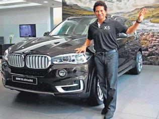 BMW-s-India-brand-ambassador-former-cricketer-Sachin-Tendulkar-poses-with-the-made-in-India-SUV-X5xDrvie-which-costs-Rs-10-lakh-less-than-the-outgoing-version-India-is-the-fifth-market-after-US-Russia-Malaysia-and-Thailand-to-get-the-X-series-which-is-not-available-in-Europe-including-Germany-The-car-is-being-made-at-BMW-s-Chennai-plant-Photo-PTI BMW-s-India-brand-ambassador-former-cricketer-Sachin-Tendulkar-poses-with-the-made-in-India-SUV-X5xDrvie-which-costs-Rs-10-lakh-less-than-the-outgoing-version-India-is-the-fifth-market-after-US-Russia-Malaysia-and-Thailand-to-get-the-X-series-which-is-not-available-in-Europe-including-Germany-The-car-is-being-made-at-BMW-s-Chennai-plant-Photo-PTI