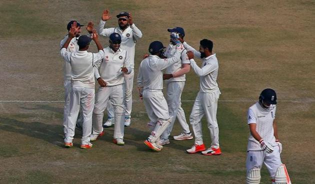 Indian players celebrate the dismissal of Joe Root on day 4 of the Mohali Test on Tuesday.(Reuters)