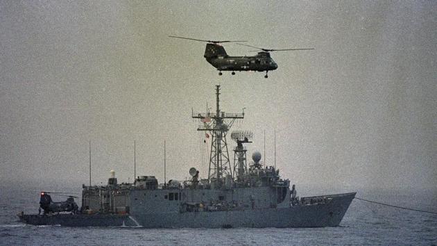 When a US Navy MH-60 helicopter flew within half a mile of two Iranian vessels in international waters, one of the vessels pointed a weapon at the helicopter, a US officials said. (AP file photo) When a US Navy MH-60 helicopter flew within half a mile of two Iranian vessels in international waters, one of the vessels pointed a weapon at the helicopter, a US officials said. (AP file photo)