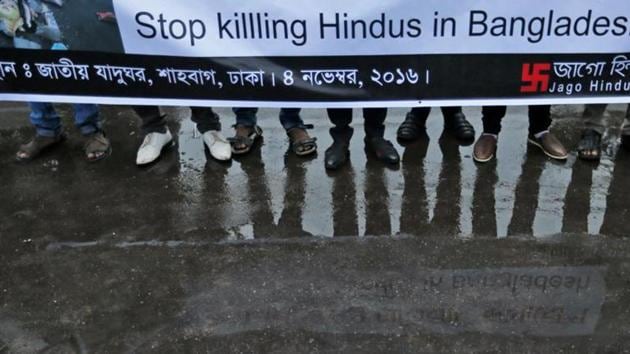Bangladeshi social activists hold a banner and participate in a rally held to protest against recent communal violence in the country, in Dhaka, Bangladesh, Friday, Nov. 4, 2016. (AP) Bangladeshi social activists hold a banner and participate in a rally held to protest against recent communal violence in the country, in Dhaka, Bangladesh, Friday, Nov. 4, 2016. (AP)