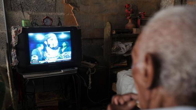 A man watches on TV a program in homage to late Cuban revolutionary icon Fidel Castro in Havana, on November 28, 2016. Hundreds of thousands of Cubans swarmed Havana's iconic Revolution Square in a tearful and nostalgic tribute to Fidel Castro on Monday, kicking off a week-long farewell to the divisive Cold War icon. (AFP) A man watches on TV a program in homage to late Cuban revolutionary icon Fidel Castro in Havana, on November 28, 2016. Hundreds of thousands of Cubans swarmed Havana's iconic Revolution Square in a tearful and nostalgic tribute to Fidel Castro on Monday, kicking off a week-long farewell to the divisive Cold War icon. (AFP)