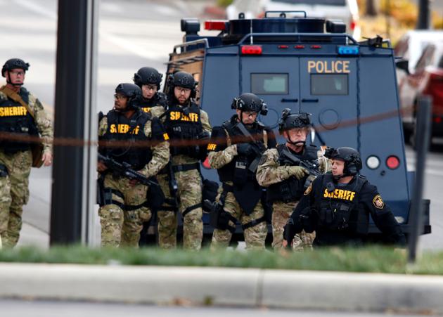 Law enforcement officials are seen outside of a parking garage on the campus of Ohio State University as they respond to an active attack in Columbus, Ohio, on November 28, 2016. Eight people were injured when an attacker apparently drove into a crowd at Ohio State University on Monday, triggering an hours-long lockdown before authorities declared the campus secure. Law enforcement shot and killed one suspect, according to local television station WBNS, which reported that police led two people out in handcuffs from a garage they had surrounded on the university's main campus in Columbus. (AFP) Law enforcement officials are seen outside of a parking garage on the campus of Ohio State University as they respond to an active attack in Columbus, Ohio, on November 28, 2016. Eight people were injured when an attacker apparently drove into a crowd at Ohio State University on Monday, triggering an hours-long lockdown before authorities declared the campus secure. Law enforcement shot and killed one suspect, according to local television station WBNS, which reported that police led two people out in handcuffs from a garage they had surrounded on the university's main campus in Columbus. (AFP)
