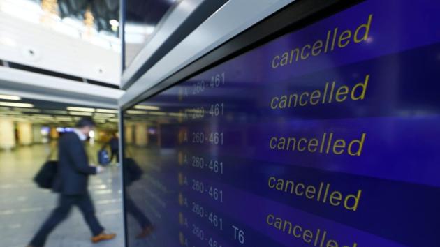 A passenger walks past a flight information board showing cancelled flights during a pilots strike of German airline Lufthansa at Frankfurt airport, Germany, November 23, 2016.(REUTERS Photo)