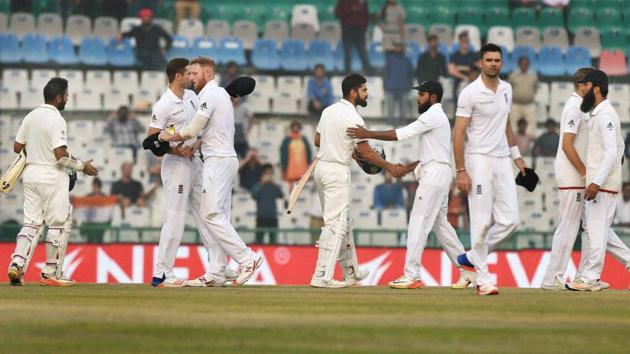 Players greet each other after India won the third Test match between India and England in Mohali on Tuesday.(PTI)