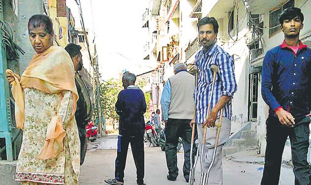 Residents passing by a manhole at Basant Nagar in Ludhiana on Monday. (HT Photo) Residents passing by a manhole at Basant Nagar in Ludhiana on Monday. (HT Photo)
