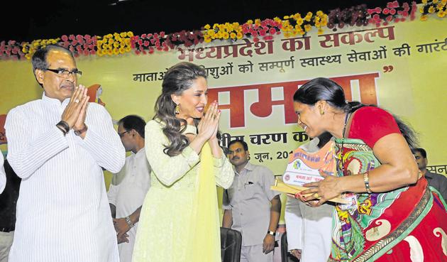 Bollywood actress Madhuri Dixit along with chief minister Sihuvraj Singh Chouhan felicitating an ASHA worker during launch of Mamta campaign in Bhopal. (Mujeeb Faruqui/HT file photo) Bollywood actress Madhuri Dixit along with chief minister Sihuvraj Singh Chouhan felicitating an ASHA worker during launch of Mamta campaign in Bhopal. (Mujeeb Faruqui/HT file photo)