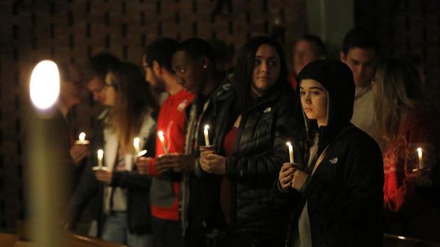 Guests stand for a moment after lighting their candles during a vigil at St Stephen's Episcopal Church in Columbus, Ohio. (AP) Guests stand for a moment after lighting their candles during a vigil at St Stephen's Episcopal Church in Columbus, Ohio. (AP)