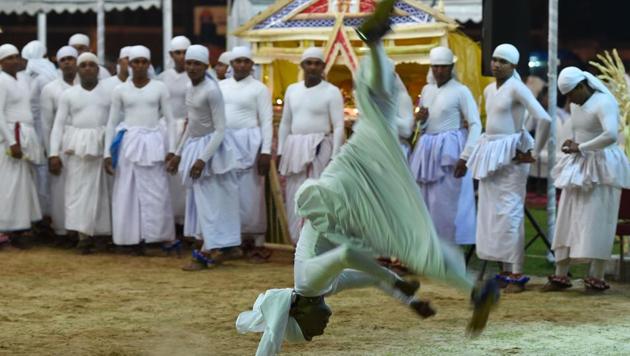 The atmosphere is illuminated with torches, coronets, turbans and bandanas as men invoke and pray to the gods. (AFP) The atmosphere is illuminated with torches, coronets, turbans and bandanas as men invoke and pray to the gods. (AFP)
