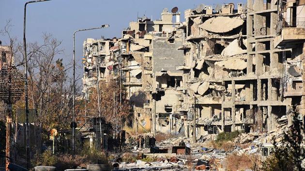 Destruction is seen in Aleppo's Bustan al-Basha neighbourhood on November 28, 2016, during Syrian pro-government forces assault to retake the entire northern city from rebel fighters. Government forces have retaken a third of rebel-held territory in Aleppo, forcing nearly 10,000 civilians to flee as they pressed their offensive to retake Syria's second city. In a major breakthrough in the push to retake the whole city, regime forces captured six rebel-held districts of eastern Aleppo over the weekend, including Masaken Hanano, the biggest of those in eastern Aleppo. / AFP PHOTO / GEORGE OURFALIAN (AFP) Destruction is seen in Aleppo's Bustan al-Basha neighbourhood on November 28, 2016, during Syrian pro-government forces assault to retake the entire northern city from rebel fighters. Government forces have retaken a third of rebel-held territory in Aleppo, forcing nearly 10,000 civilians to flee as they pressed their offensive to retake Syria's second city. In a major breakthrough in the push to retake the whole city, regime forces captured six rebel-held districts of eastern Aleppo over the weekend, including Masaken Hanano, the biggest of those in eastern Aleppo. / AFP PHOTO / GEORGE OURFALIAN (AFP)
