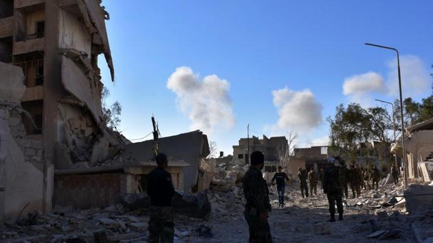 Smoke billows during fighting as Syrian pro-government forces walk on a street on November 27, 2016 in the Masaken Hanano district in eastern Aleppo, a day after they resized it from rebel fighters. Syria regime forces seized two new rebel-held districts in Aleppo a day after they retook the largest opposition-controlled neighbourhood in the second city, a monitor said. The capture of Masaken Hanano -- which had been the biggest rebel-held district of Aleppo -- was a major breakthrough in a 13-day regime offensive to retake the entire city. (AFP) Smoke billows during fighting as Syrian pro-government forces walk on a street on November 27, 2016 in the Masaken Hanano district in eastern Aleppo, a day after they resized it from rebel fighters. Syria regime forces seized two new rebel-held districts in Aleppo a day after they retook the largest opposition-controlled neighbourhood in the second city, a monitor said. The capture of Masaken Hanano -- which had been the biggest rebel-held district of Aleppo -- was a major breakthrough in a 13-day regime offensive to retake the entire city. (AFP)