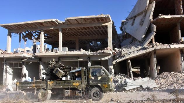 A vehicle of Syrian pro-government forces drives past damaged buildings on November 27, 2016 in the Masaken Hanano district in eastern Aleppo, a day after they resized it from rebel fighters. Syria regime forces seized two new rebel-held districts in Aleppo a day after they retook the largest opposition-controlled neighbourhood in the second city, a monitor said. The capture of Masaken Hanano -- which had been the biggest rebel-held district of Aleppo -- was a major breakthrough in a 13-day regime offensive to retake the entire city. (AFP) A vehicle of Syrian pro-government forces drives past damaged buildings on November 27, 2016 in the Masaken Hanano district in eastern Aleppo, a day after they resized it from rebel fighters. Syria regime forces seized two new rebel-held districts in Aleppo a day after they retook the largest opposition-controlled neighbourhood in the second city, a monitor said. The capture of Masaken Hanano -- which had been the biggest rebel-held district of Aleppo -- was a major breakthrough in a 13-day regime offensive to retake the entire city. (AFP)