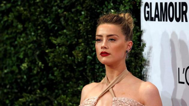Actor Amber Heard poses at the Glamour Women of the Year Awards in Los Angeles.(REUTERS)