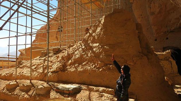 Afghan archeological guard, Hakim Safam, stands in front of the reconstructed foot of the Salsal Buddha, which was 58 metres high before being destroyed. (AFP) Afghan archeological guard, Hakim Safam, stands in front of the reconstructed foot of the Salsal Buddha, which was 58 metres high before being destroyed. (AFP)