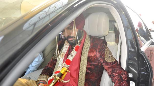 Yuvi wore a lush red sherwani with golder salwar and red pagdi. (Sant Arora/ HT Photo) Yuvi wore a lush red sherwani with golder salwar and red pagdi. (Sant Arora/ HT Photo)