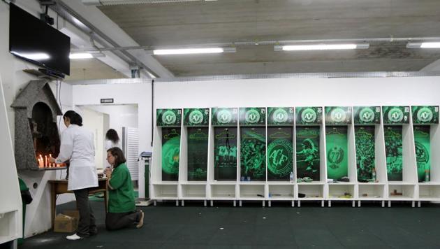 Employees of Chapecoense soccer team pray inside the team's locker room at the Arena Conda stadium in Chapeco, Brazil. A plane crash in Colombia wiped out almost the entire squad. (REUTERS) Employees of Chapecoense soccer team pray inside the team's locker room at the Arena Conda stadium in Chapeco, Brazil. A plane crash in Colombia wiped out almost the entire squad. (REUTERS)