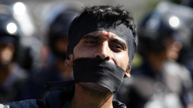 A Nepalese activist with his mouth covered gathers with others from the Federal Alliance (members of the Madhesi and ethnic communities) to voice their anti-constitution concerns on the first anniversary of Nepal's constitution in Kathmandu on September 19.(AFP File) A Nepalese activist with his mouth covered gathers with others from the Federal Alliance (members of the Madhesi and ethnic communities) to voice their anti-constitution concerns on the first anniversary of Nepal's constitution in Kathmandu on September 19.(AFP File)