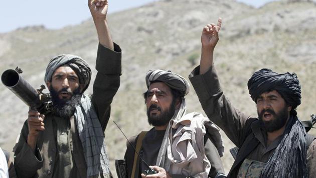 Taliban fighters react to a speech by their senior leader in the Shindand district of Herat province, Afghanistan, in May 2016. (AP File) Taliban fighters react to a speech by their senior leader in the Shindand district of Herat province, Afghanistan, in May 2016. (AP File)