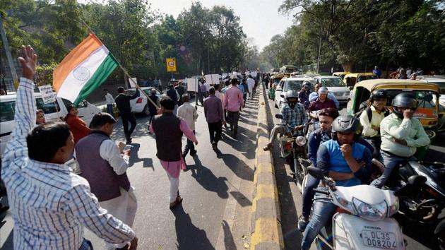 BJP leaders take out a march against black money and corruption in New Delhi on Friday.(PTI)