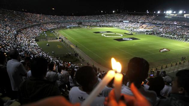 Fans of Atletico Nacional soccer club light candles as they pay tribute to the players of Brazilian club Chapecoense, killed in the recent airplane crash in Colombia. (Fredy Builes/REUTERS)