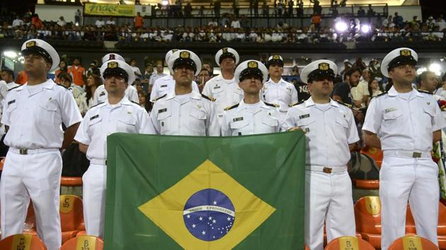 The emotional high point of the tribute in Medellin was an address by the Brazilian foreign minister Jose Serra, who travelled to the city along with a military cargo plane to help repatriate the bodies of his nations’ victims. (RAUL ARBOLEDA/AFP)