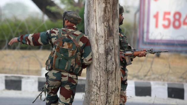 Indian Army soldiers take position during a gun battle with armed militants at an army base at Nagrota on November 28.(AFP File Photo)