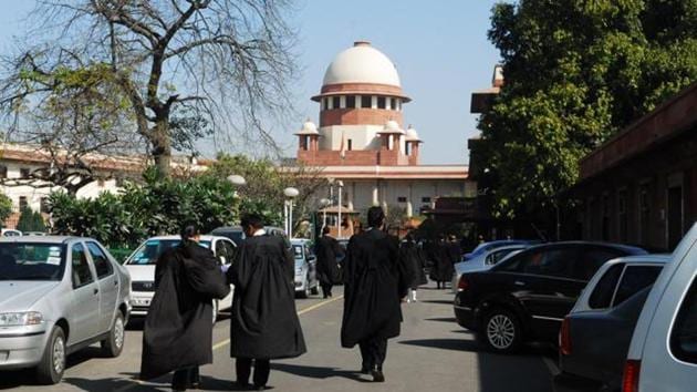 Lawyers outside Supreme Court in New Delhi. Vacancies in the Supreme Court and 24 high courts have been a bone of contention between the judiciary and executive. (HT Photo) Lawyers outside Supreme Court in New Delhi. Vacancies in the Supreme Court and 24 high courts have been a bone of contention between the judiciary and executive. (HT Photo)